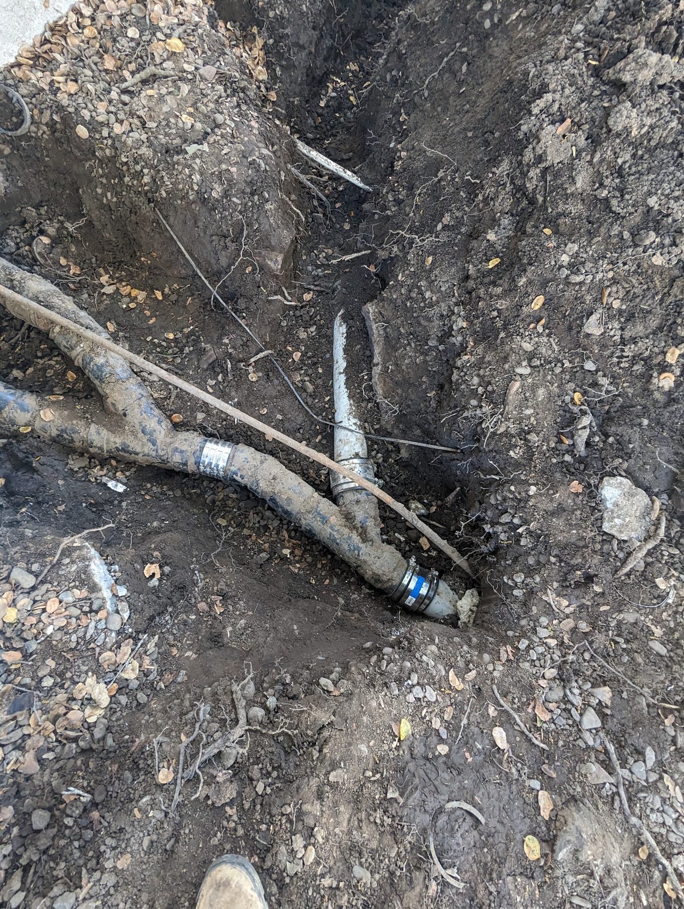 Sewer lateral repair, new fittings in